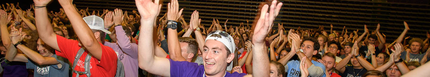 Students cheer and celebrate in a large crowd